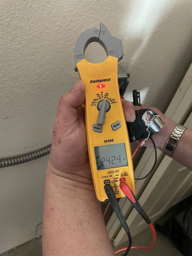 Voltage testing with clamp meter during Ceiling Fan Installation in Springville